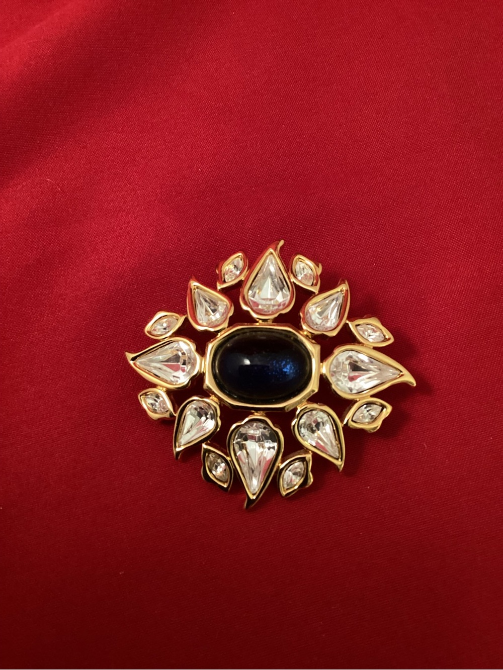 Gold-Tone Brooch with Blue Cabochon and Clear Teardrops